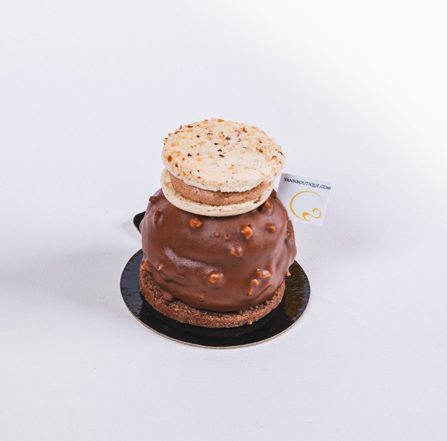 Hazelnut cream-filled choux pastry with macaron garnish in Calgary.