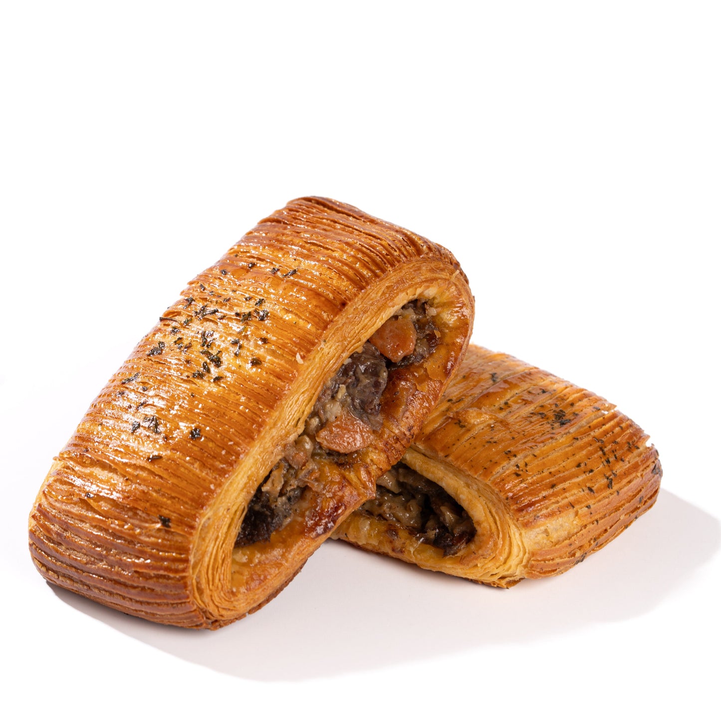 Handcrafted savoury croissants featuring salmon and boeuf bourguignon fillings at Yann Haute Patisserie in Calgary.
