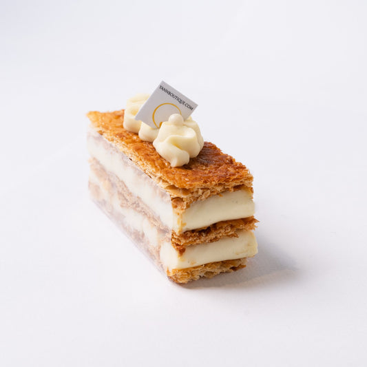 Elegant mille feuille featuring layers of crisp puff pastry and creamy Madagascar vanilla filling