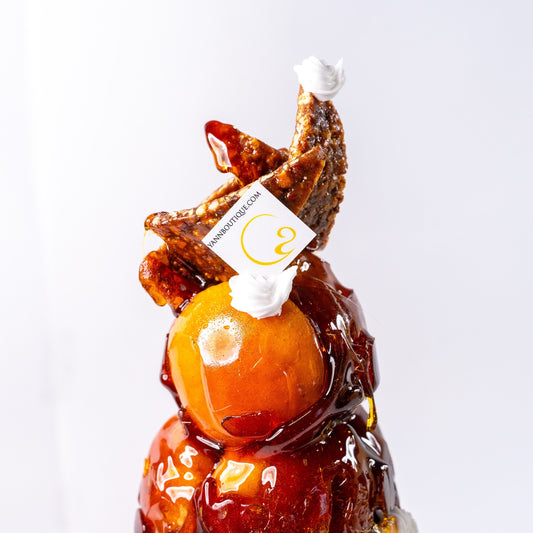 French pièce montée featuring handcrafted cream-filled choux pastries for weddings and celebrations