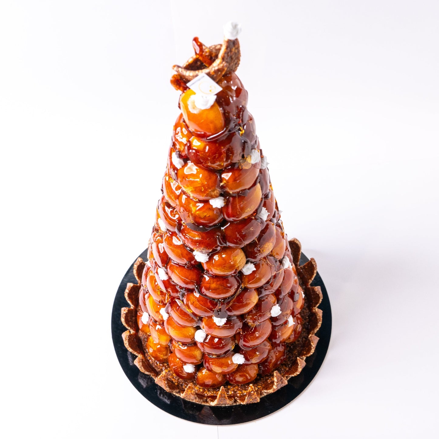 Croquembouche or piece montee is a traditional French dessert perfect for all occasions! Yann Haute Patisserie, yellow house with the best cakes, macarons, bread, chocolate in Calgary!