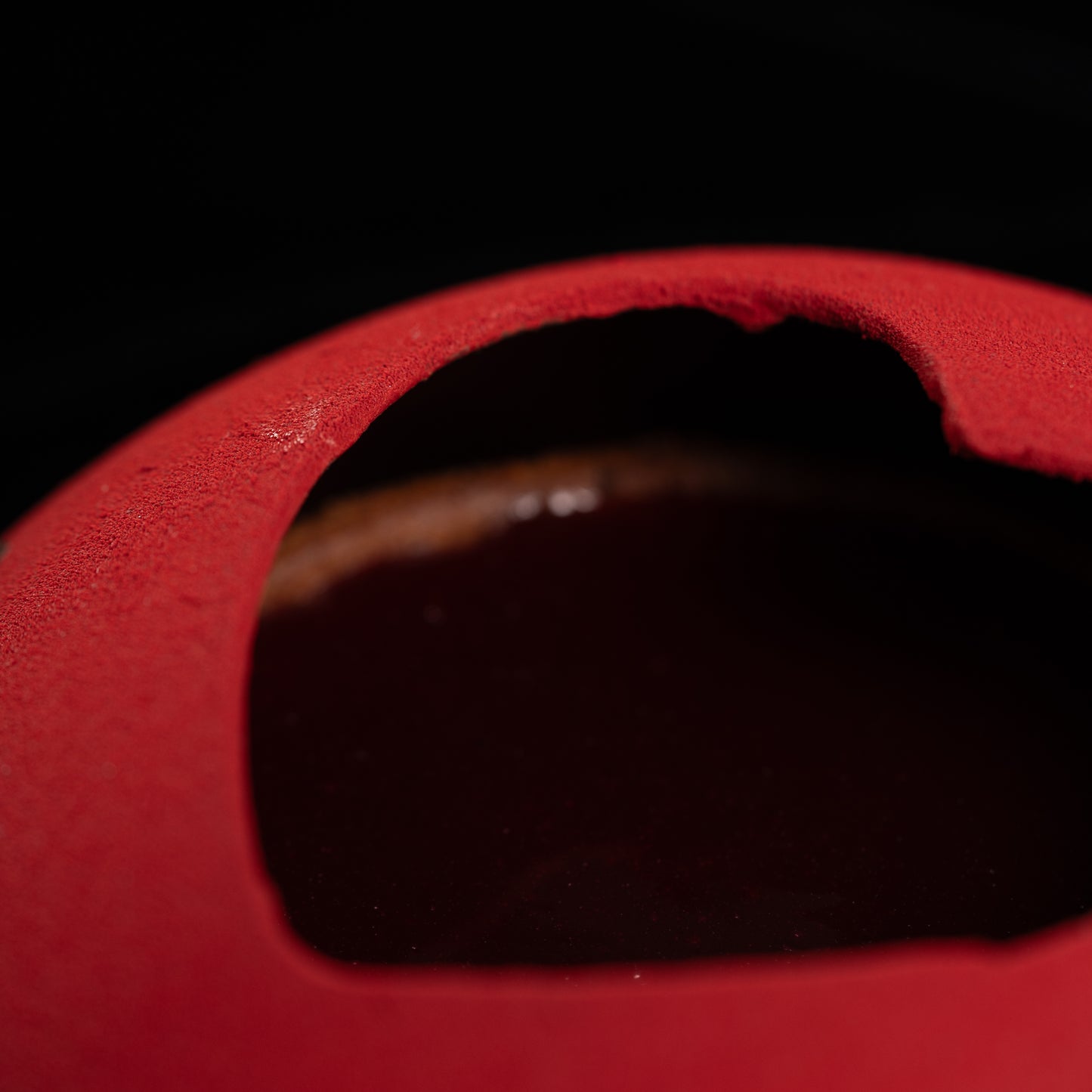 The lovely red chocolate shell protecting our little cake for two