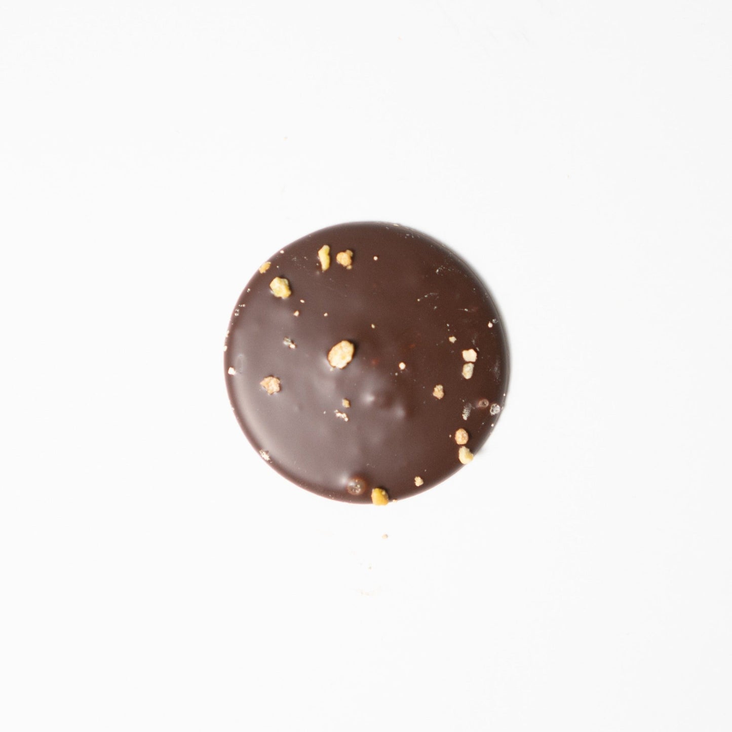 Chocolate palet made with Valrhona, best chocolate. Only real and natural ingredients at Yann Haute Patisserie, authentic & traditional French bakery & pastry shop in a yellow house in Calgary. Relais Desserts Pastry chef Yann Blanchard creates desserts, cakes, macarons, ice cream, Canneles, croissants, baguette & bread.