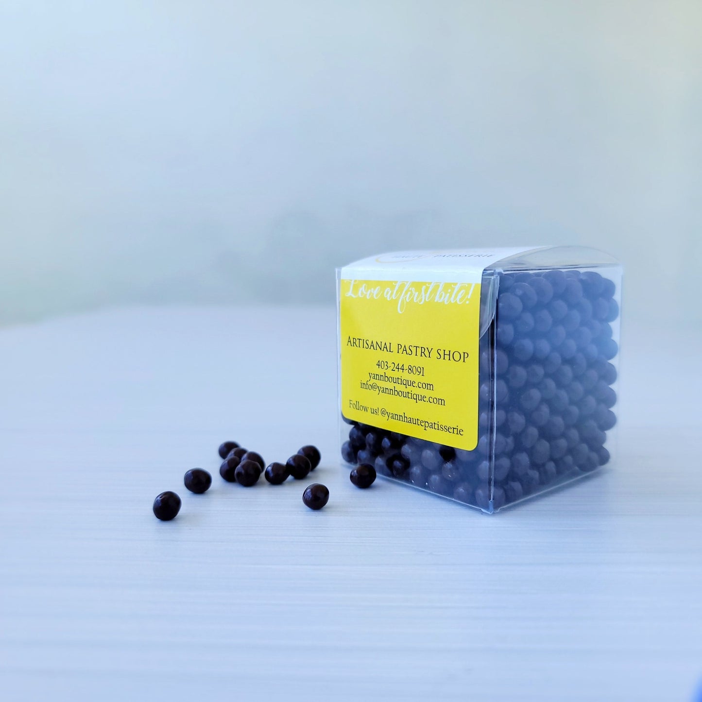 Dark Valrhona Pearls Cube - Authentic French desserts at Yann Haute Patisserie your Calgary bakery for the best cakes, macarons, croissants, breads and more!