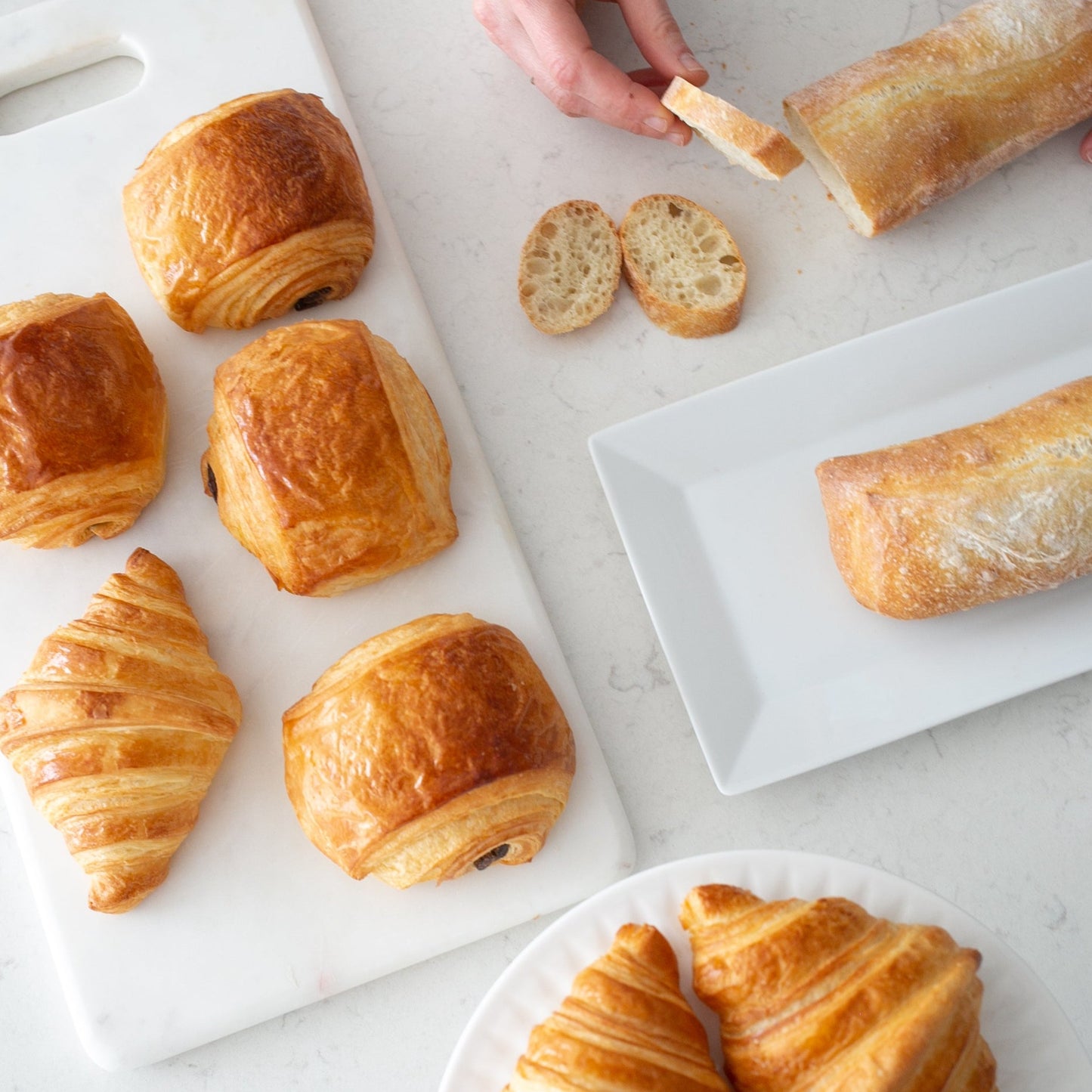 Indulge in authentic French pastries and cakes at Yann Haute Patisserie in Calgary. Located on 23 Avenue Southwest in a charming yellow house, our bakery offers macarons, Tiramisu, Mille Feuille, birthday cakes, baguettes, croissants, and chocolates. Catering to dietary needs, we provide gluten-free, dairy-free, egg-free, and vegan options.