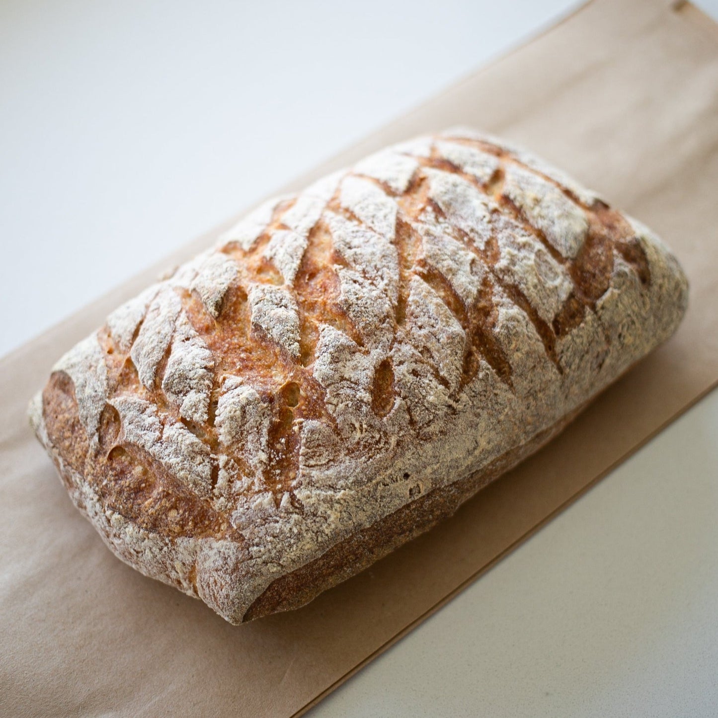 Beautiful loaf! Yann Haute Patisserie, authentic French bakery for the best desserts, cakes, croissants and macarons in this happy yellow house pastry shop.