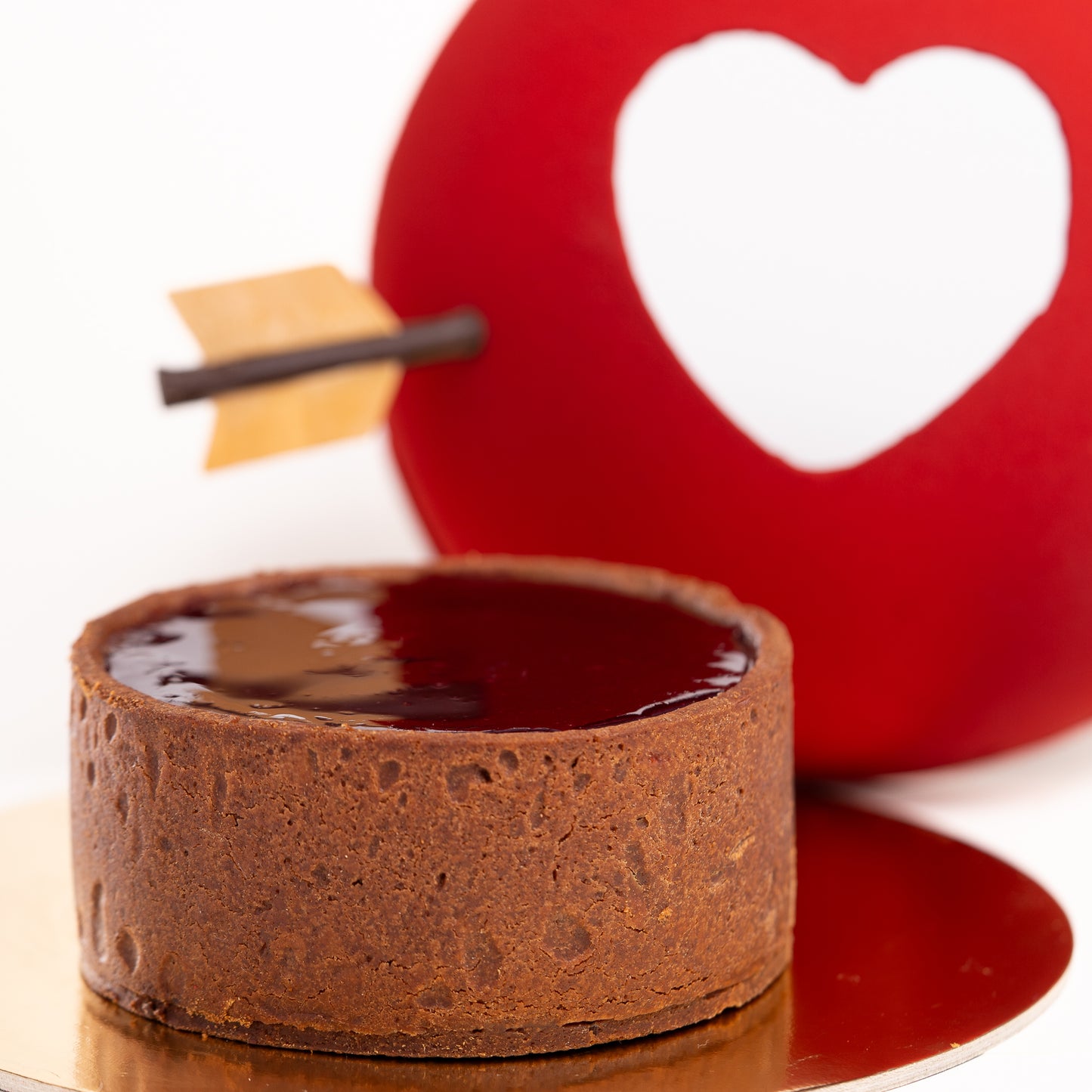 Dark chocolate crémeux, chocolate and cocoa nibs shortbread, and a crunchy chocolate base are balanced with a raspberry crème brûlée and&nbsp; berry compote.