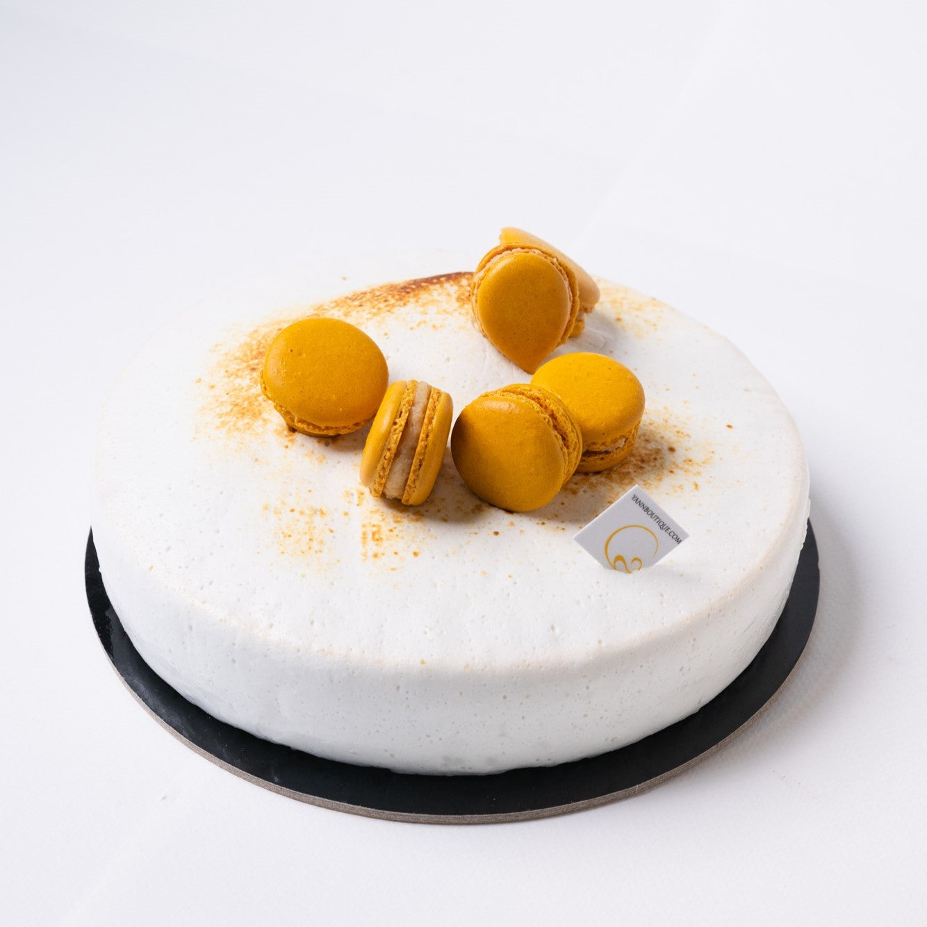 Tart lemon cremeux on almond cake with soft meringue topping, Calgary.