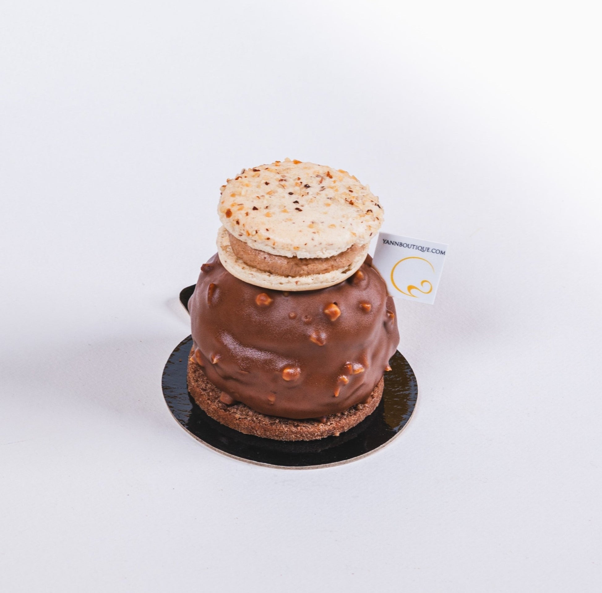Hazelnut cream-filled choux pastry with macaron garnish in Calgary.
