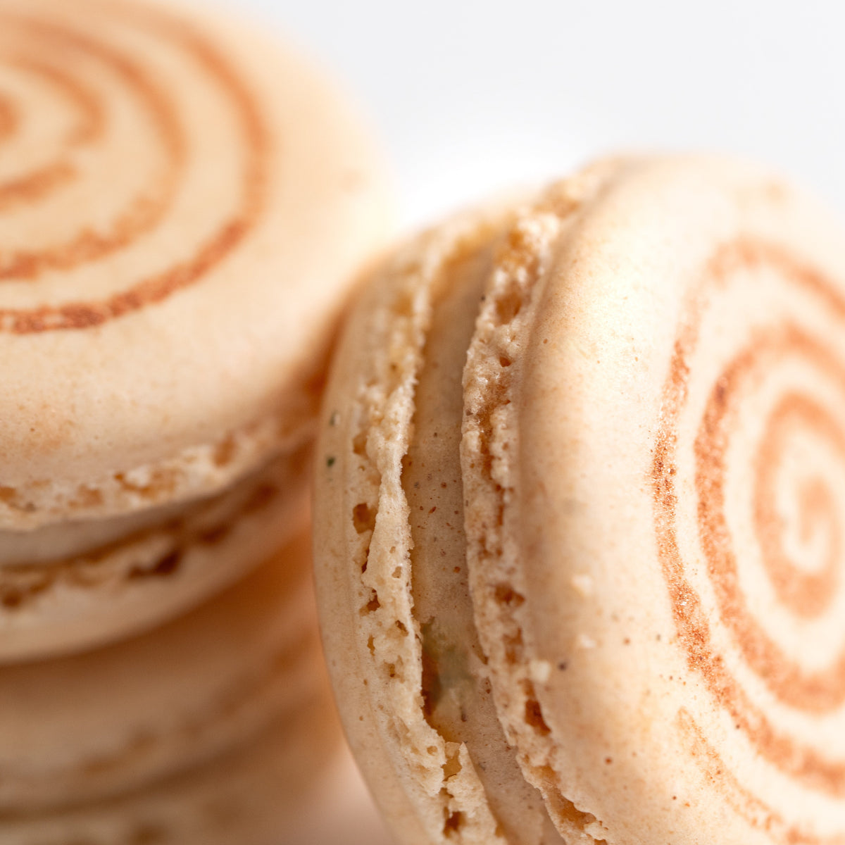 Cinnamon Roll French macaron handcrafted at Yann Haute Patisserie in Calgary.