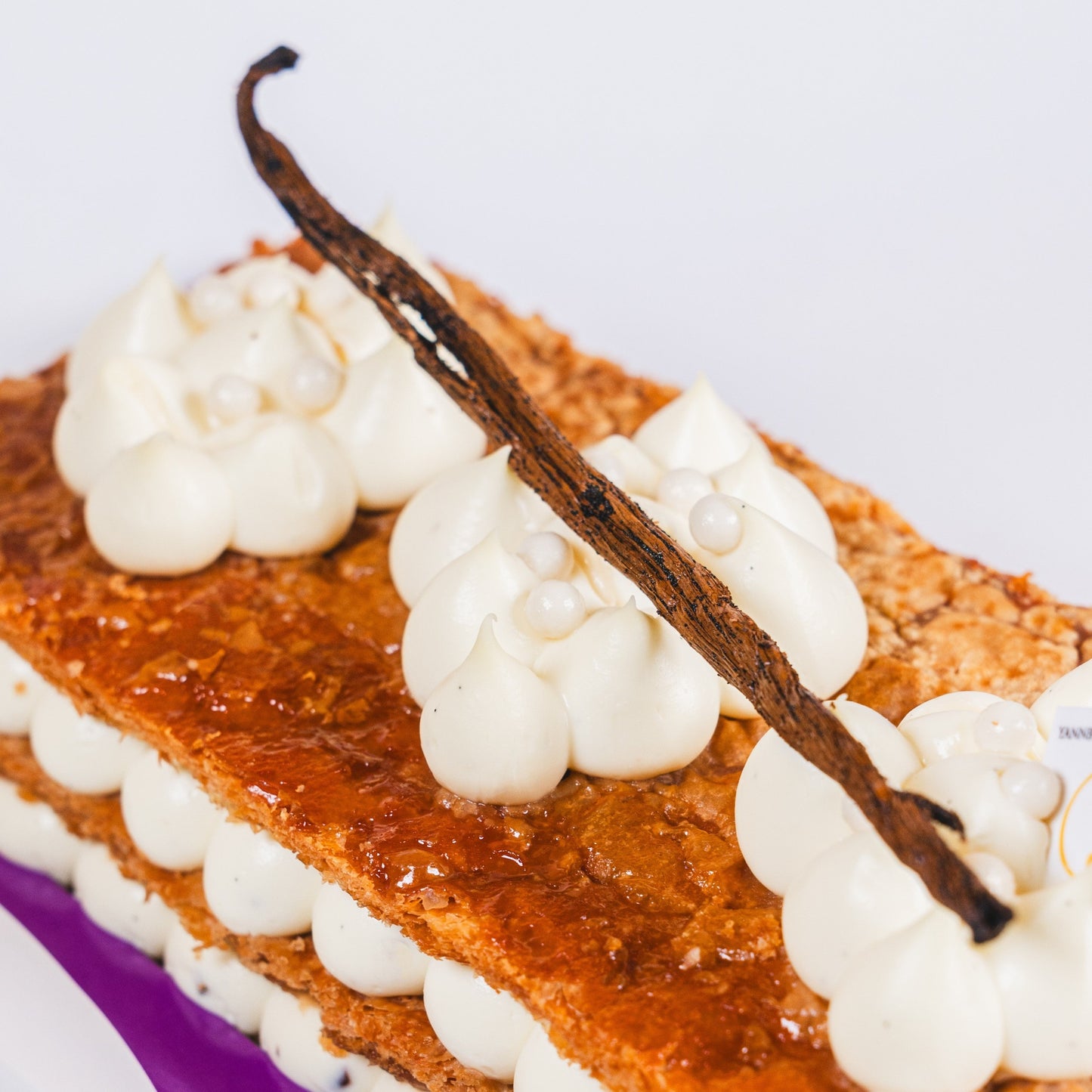 Traditional French mille feuille made with flaky puff pastry and Madagascar vanilla bean cream