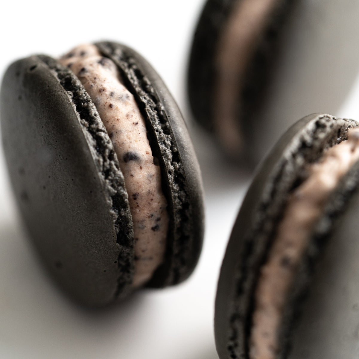 Cookies & Cream French macaron handcrafted at Yann Haute Patisserie in Calgary.