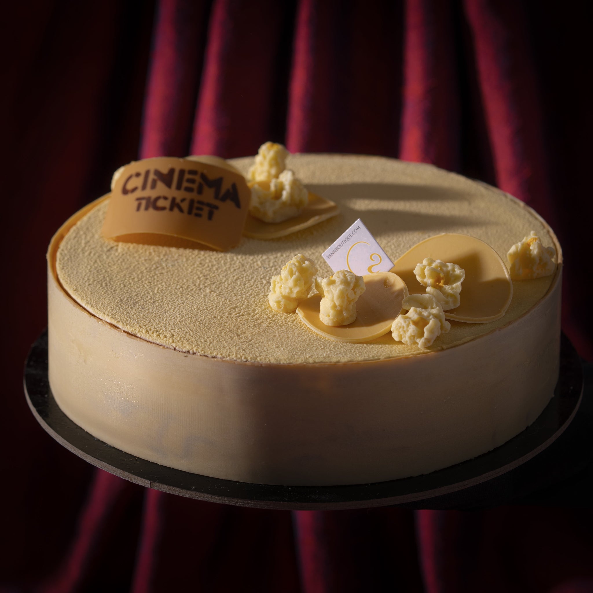 Father's Day popcorn dessert from Yann Haute Patisserie featuring corn crunch, chocolate blondie, corn cremeux, and single-origin chocolate bavaroise with a white chocolate velvet finish.