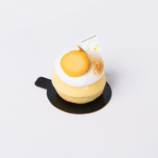 Handcrafted gluten-free lemon tart topped with soft lemon meringue and lemon compote