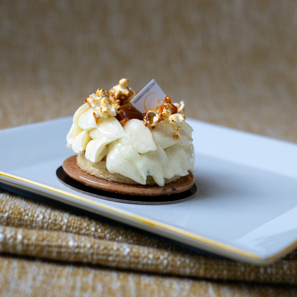 Handcrafted French Thanksgiving dessert from Yann Haute Patisserie with pumpkin, vanilla bean, white chocolate and caramel popcorn.