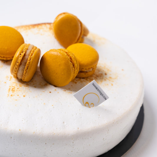 Gluten-free lemon tart featuring almond and lemon cake, lemon crémeux, crushed lemon compote, and soft meringue
