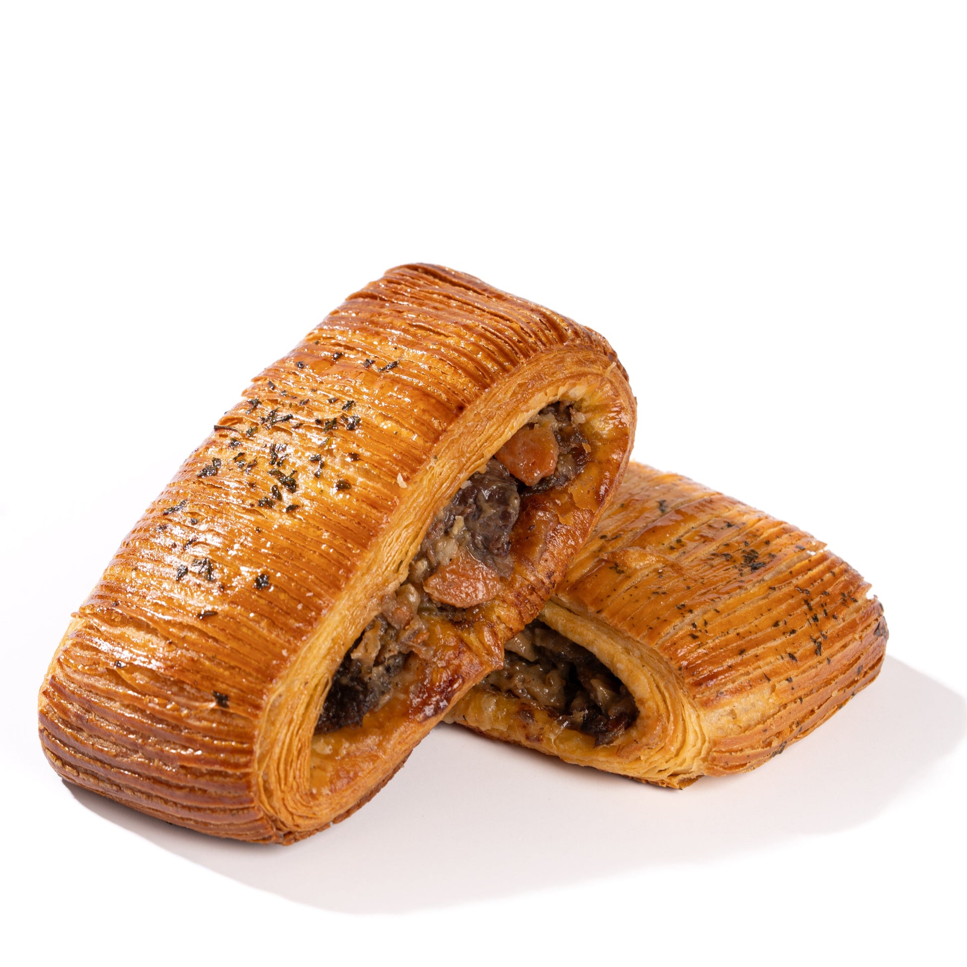 Handcrafted savoury croissants featuring salmon and boeuf bourguignon fillings at Yann Haute Patisserie in Calgary.