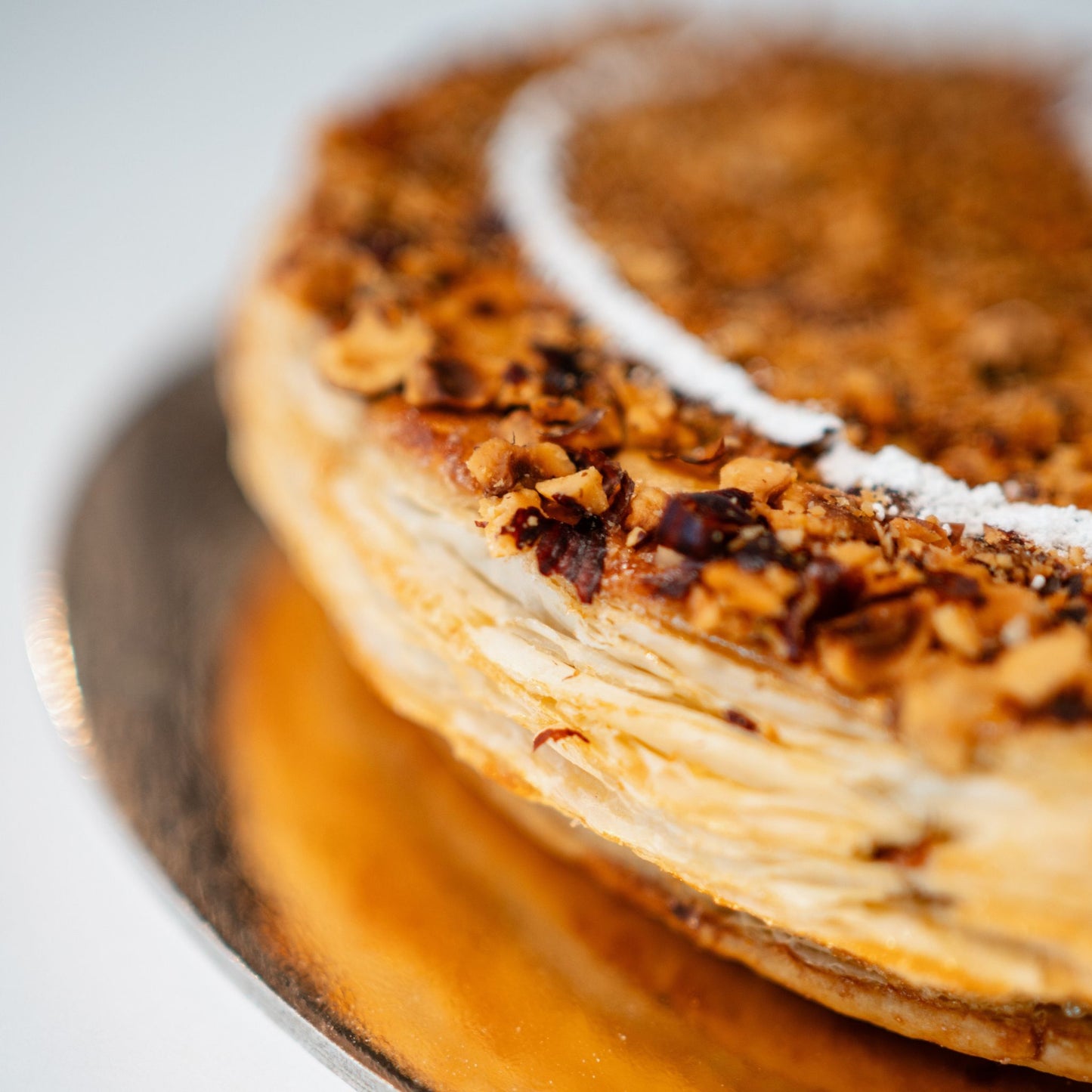 Our Galette des Rois 2025 is here!

Flaky, buttery layers + hazelnut filling = pure bliss. 🎉 Find the fève and be crowned king or queen!