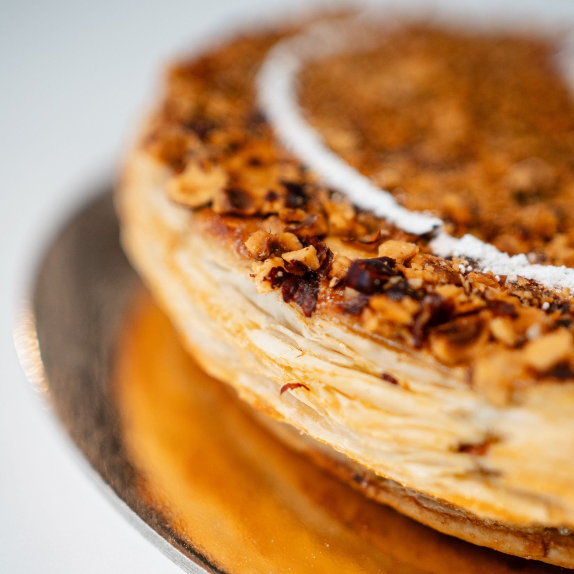 Our Galette des Rois 2025 is here!

Flaky, buttery layers + hazelnut filling = pure bliss. 🎉 Find the fève and be crowned king or queen!