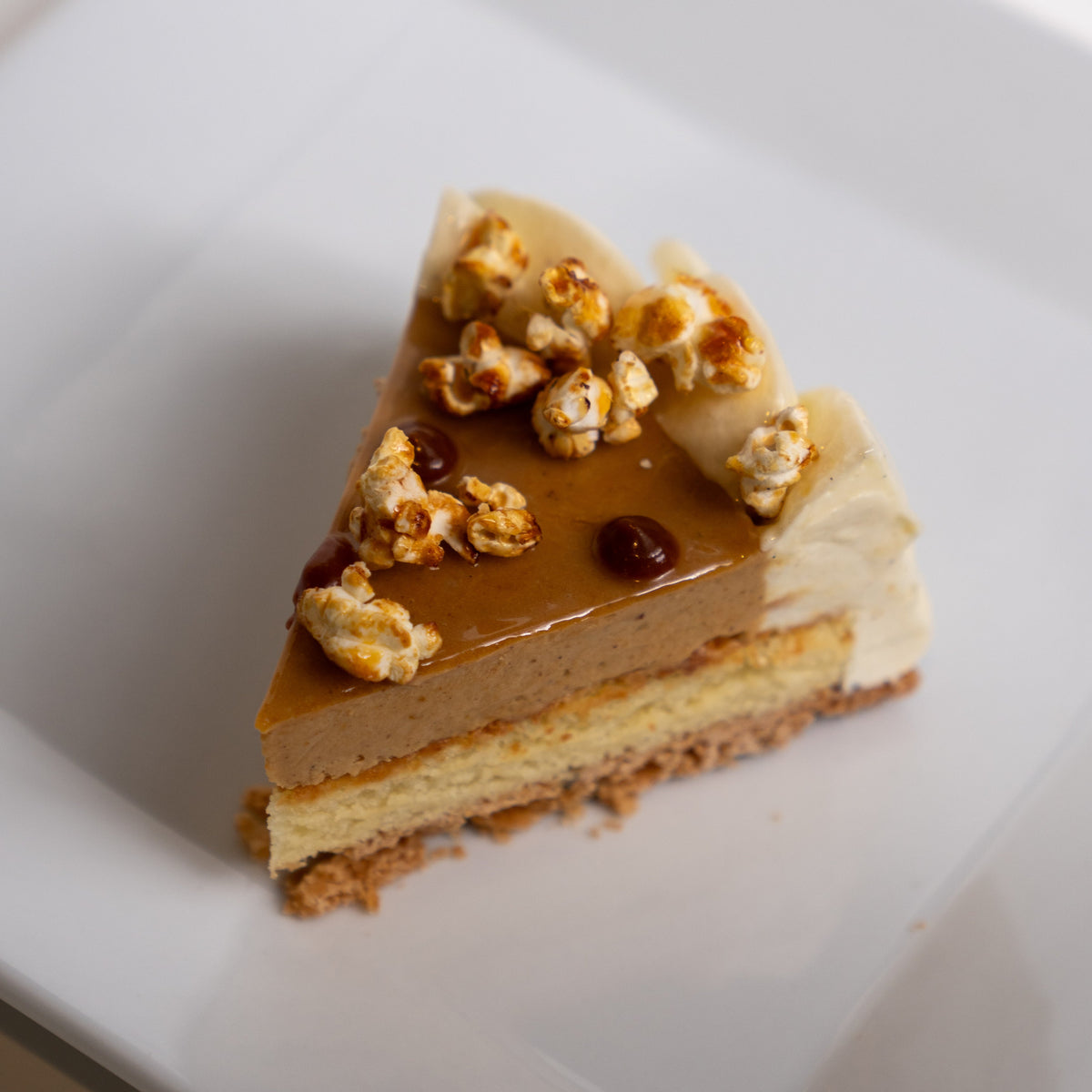 Where to find a unique Thanksgiving cake in Calgary with pumpkin crème brûlée, white chocolate cake, vanilla chantilly and caramel popcorn crunch.