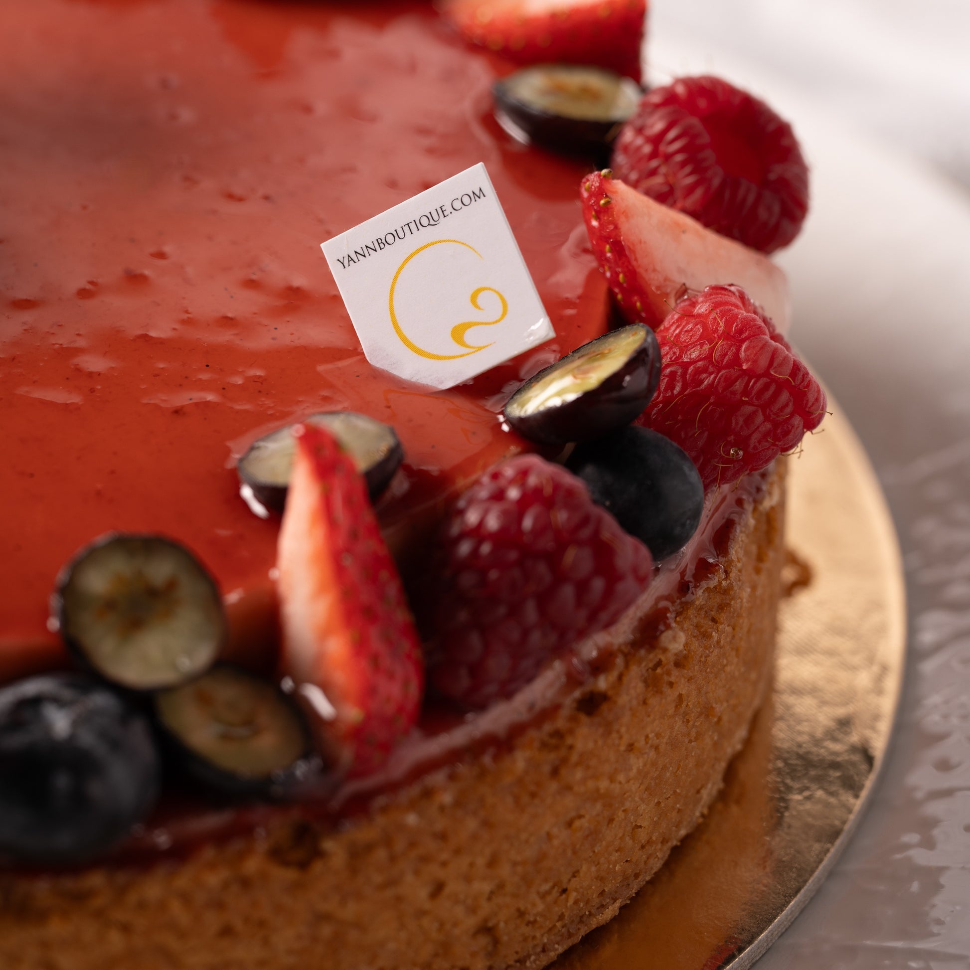 Slice of raspberry coconut tart served on plate, Mother’s Day dessert Calgary, handcrafted French pastry with fresh berries, luxury bakery experience YYC, perfect dessert for sharing