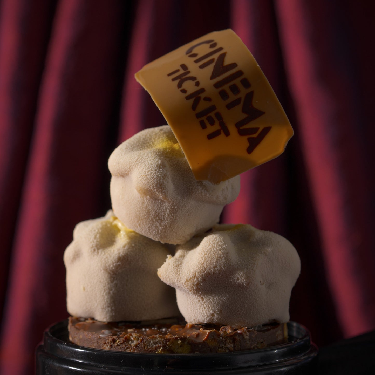 Gourmet Father's Day dessert combining popped corn crunch, cashew praline base, corn chocolate blondie, corn chocolate praline, and silky chocolate ganache from Calgary's Yann Haute Patisserie.