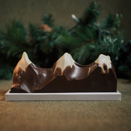 A sculptural chocolate centrepiece blending deep Valrhona Ghana dark chocolate with crisp, creamy hazelnut praliné peaks. Created by our pastry team as an edible homage to the Three Sisters — perfect for gifting, sharing, or celebrating special moments.