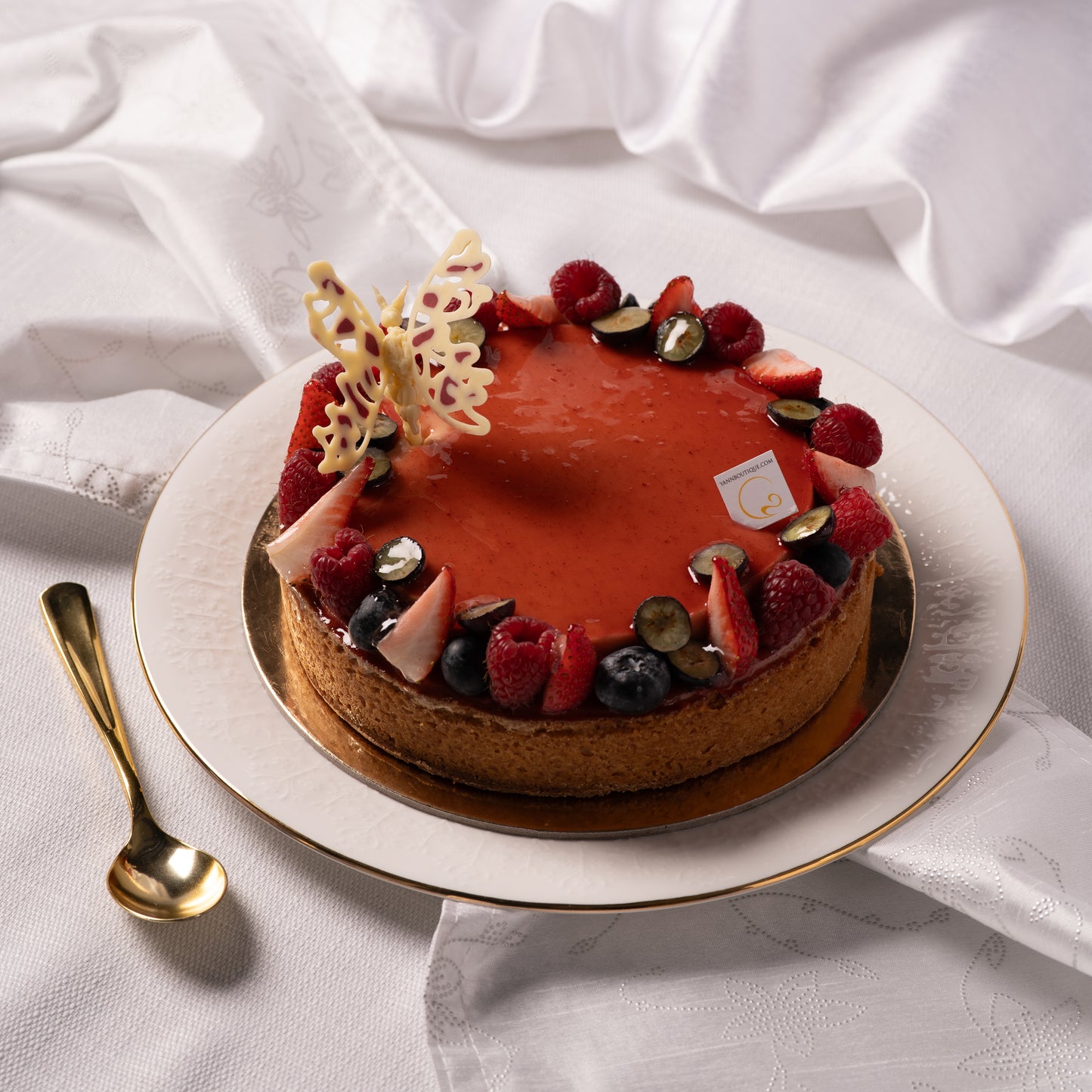 Slice of raspberry coconut tart served on plate, Mother’s Day dessert Calgary, handcrafted French pastry with fresh berries, luxury bakery experience YYC, perfect dessert for sharing
