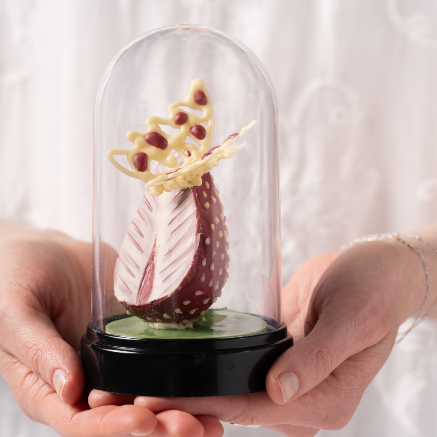 Strawberry chocolate dessert Calgary, handcrafted Easter pastry with coconut praline and chocolate butterfly, fresh strawberry dessert by Yann Haute Patisserie, luxury bakery YYC, elegant seasonal treat