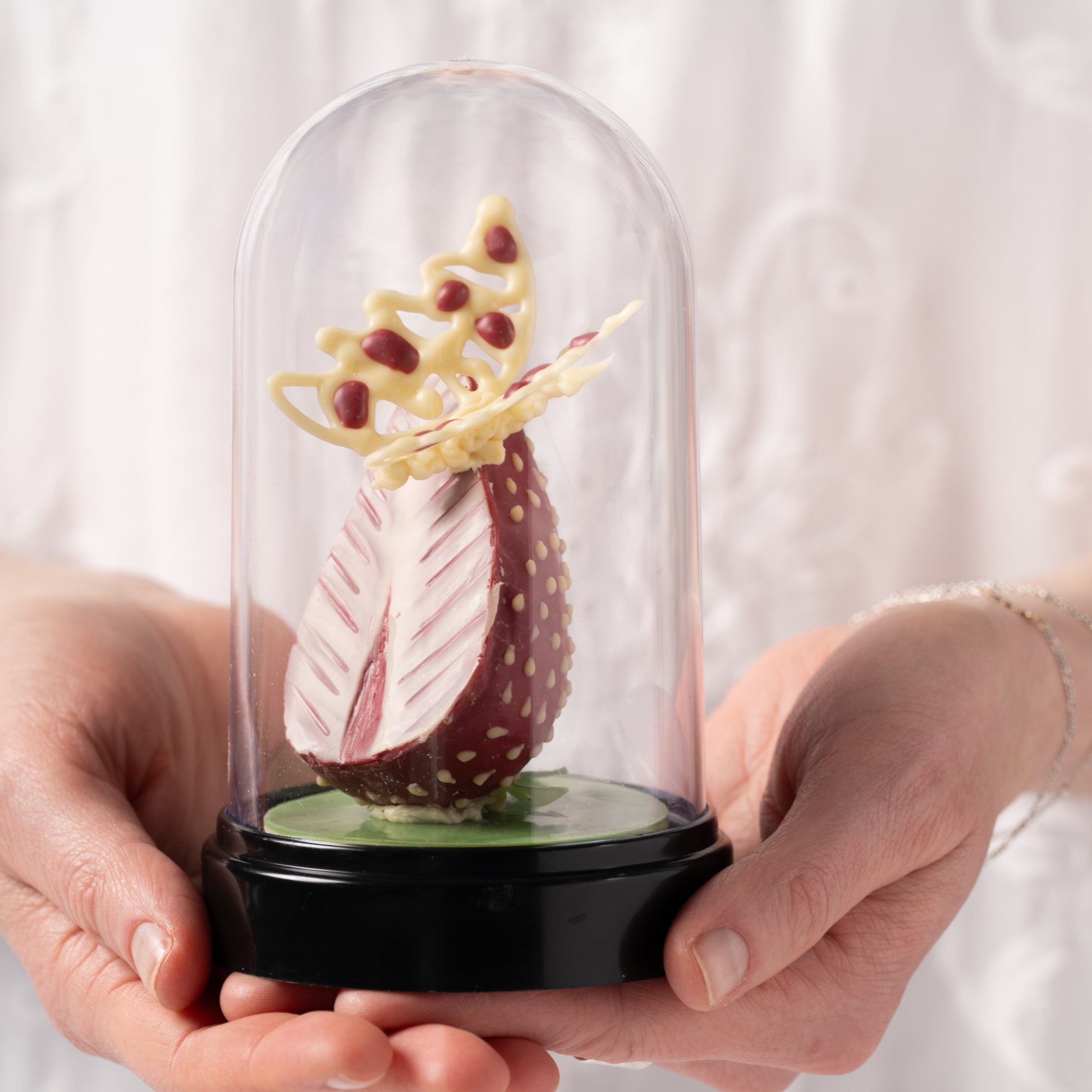 Strawberry chocolate dessert Calgary, handcrafted Easter pastry with coconut praline and chocolate butterfly, fresh strawberry dessert by Yann Haute Patisserie, luxury bakery YYC, elegant seasonal treat