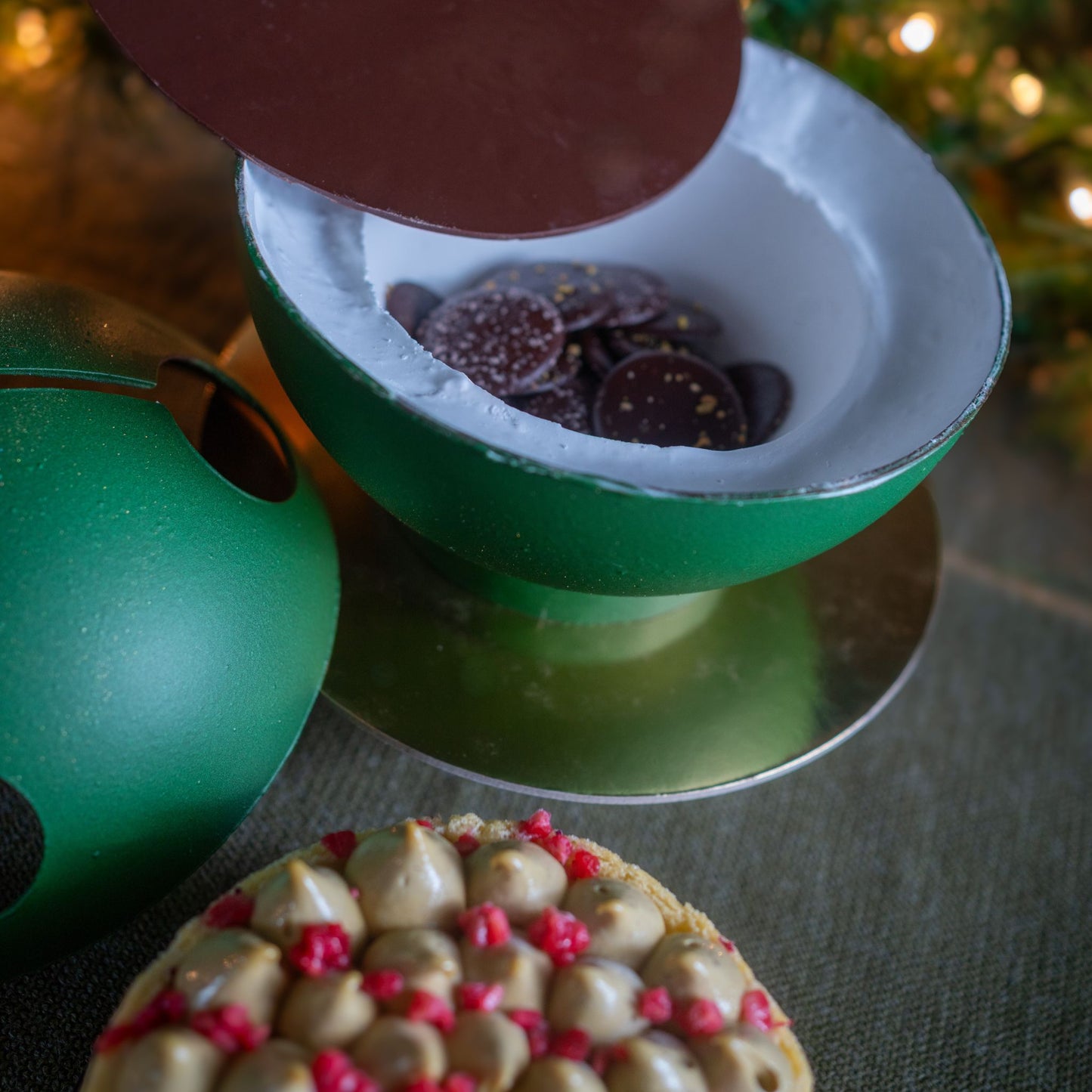 Pistachio and orange blossom holiday cake with raspberry biscuit and pistachio crunch from Yann