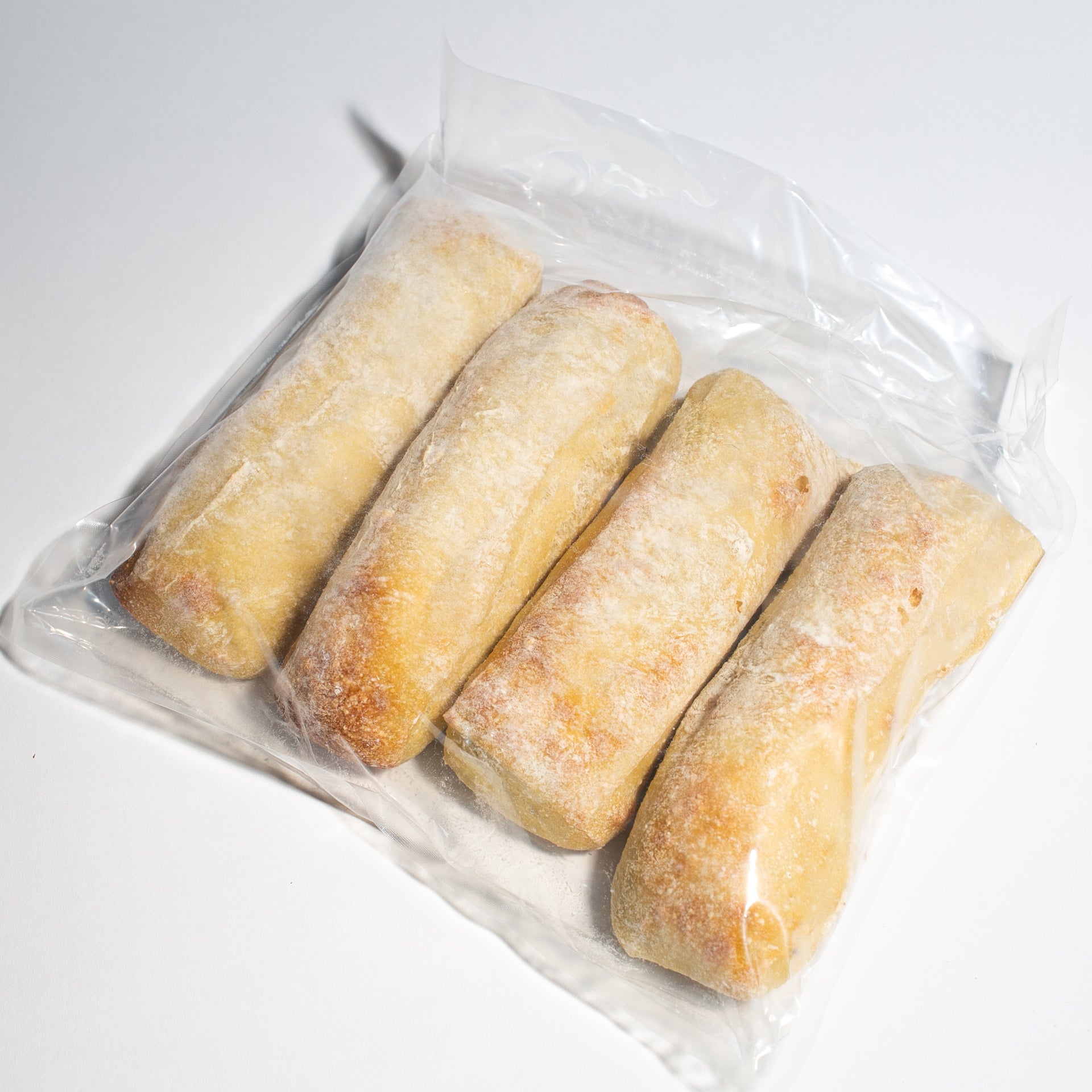 Frozen to oven demi baguettes! - Yann Haute Patisserie, authentic French bakery for the best desserts, cakes, croissants and macarons in this happy yellow house pastry shop. 