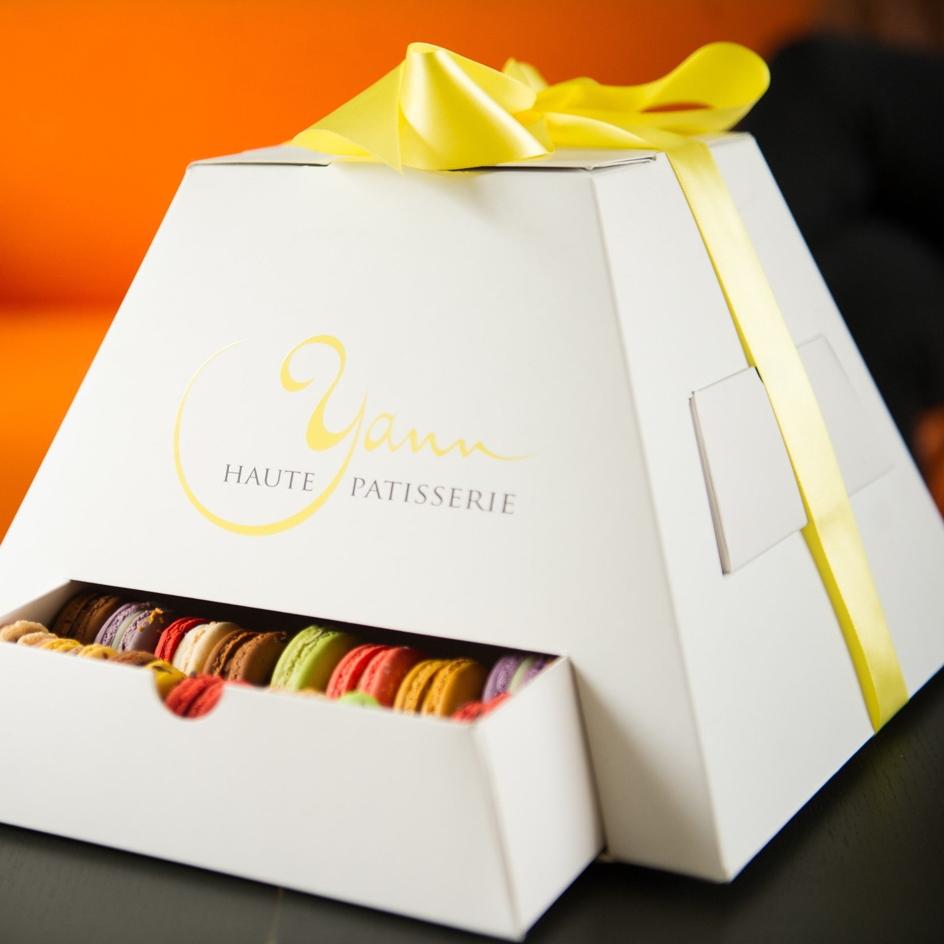 Macarons galore in our amazing pyramid box! Macarons since 2010 - Yann Haute Patisserie, authentic French bakery for the best desserts, cakes, croissants and macarons in this happy yellow house pastry shop. 